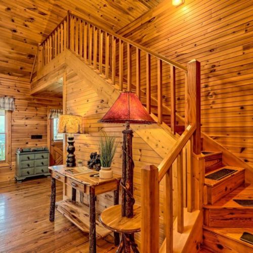 Go under the stairs to the dining room / kitchen / master bedroom