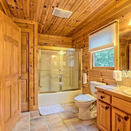 Soaker tub and large sized bathroom in loft area