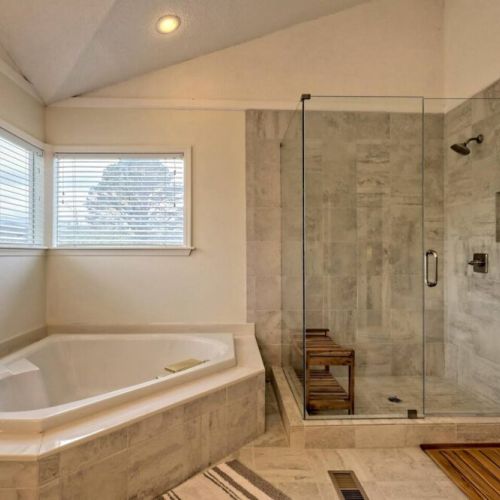 A soaker jet tub and walk in shower in the ensuite