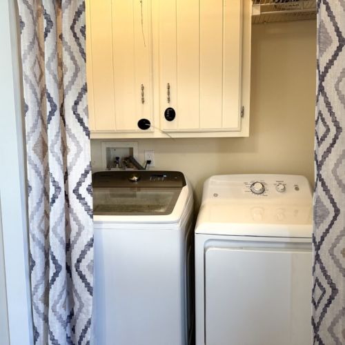 Washer & dryer in twin room.