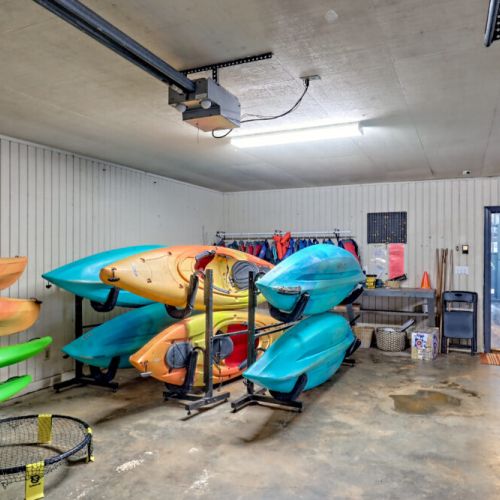 Garage with complimentary kayaks and paddleboards.