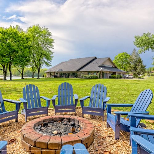 Seating for 10 around the shaded fire pit area at the back of the very large backyard.