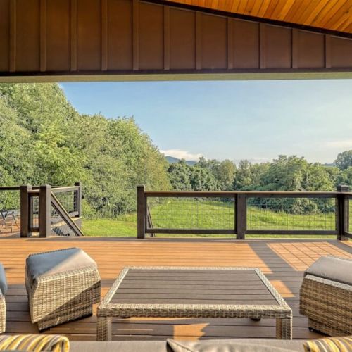 Covered deck area with lots of seating for the whole family and company