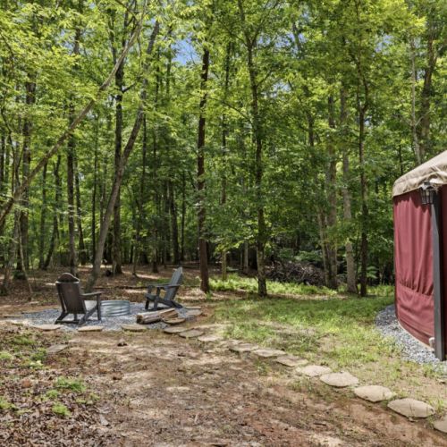 Firepit beside yurt for your use.