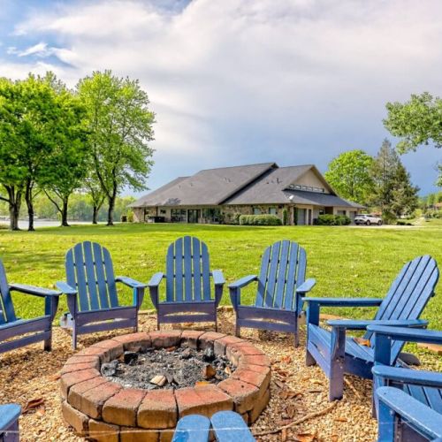 Seating for 10 around the shaded fire pit area at the back of the very large backyard.