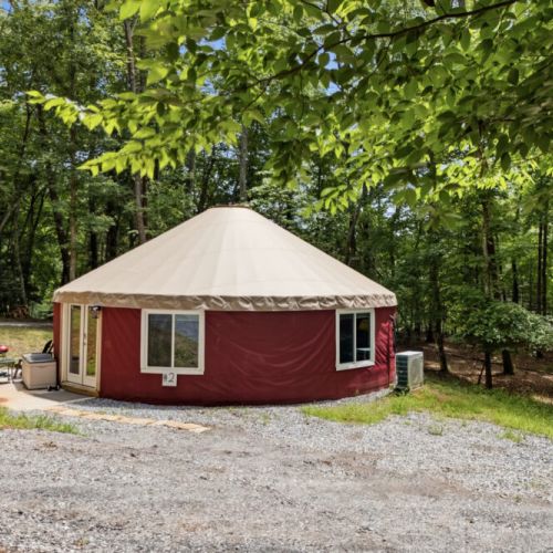 Front of yurt and parking for one vehicle.