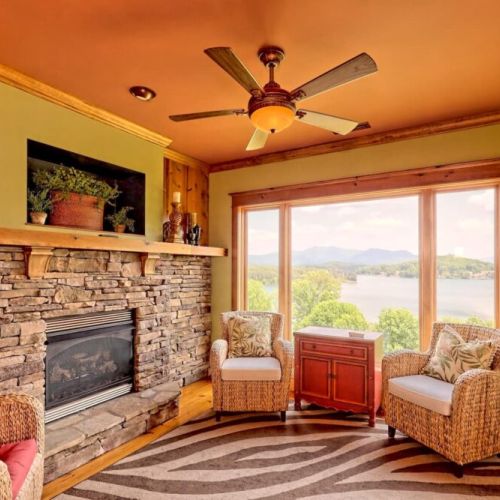 Indoor sitting area with large stone fireplace