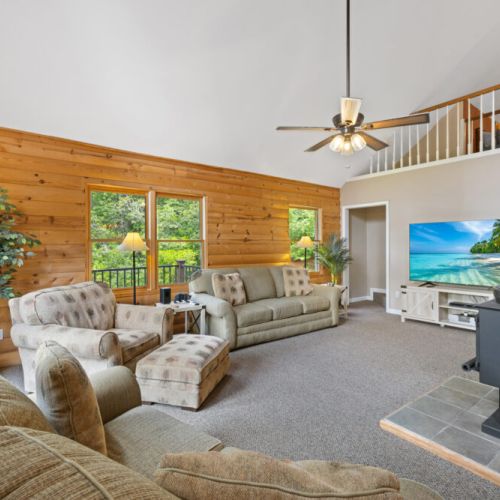 Living area with a TV and comfy couches!