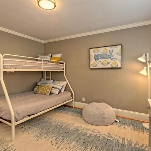 Bunk room with a full and twin bed.