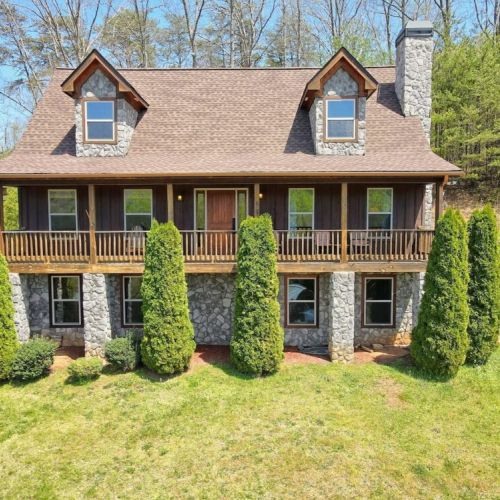 Sits up for the perfect view with drive up garage and rear entry to the kitchen