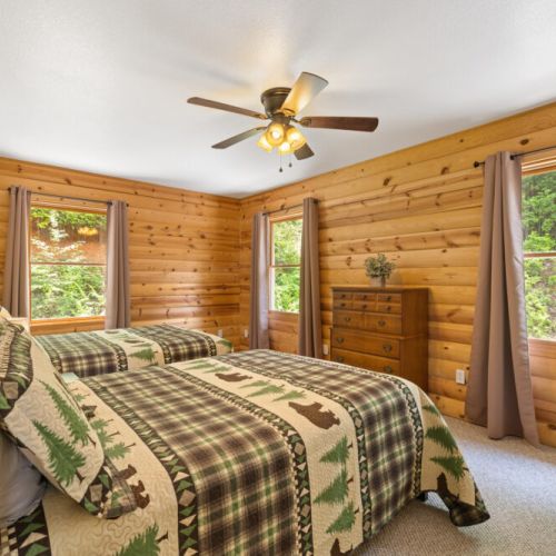 Main floor bedroom with two queen beds.