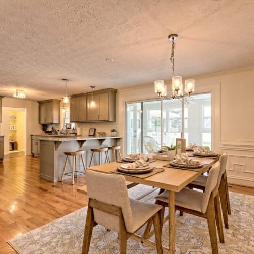 Beautiful floors with a nice open floor plan of the dining, kitchen with breakfast bar.