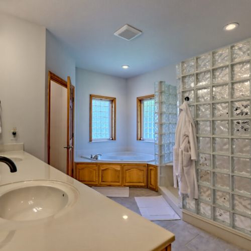Primary bathroom with a shower & tub.