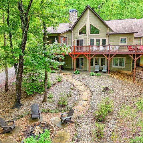 Aerial of back of home & fire pit.