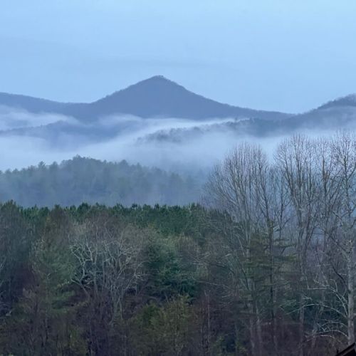 Picture perfect! You are amongst the clouds. Have coffee and appreciate that view!