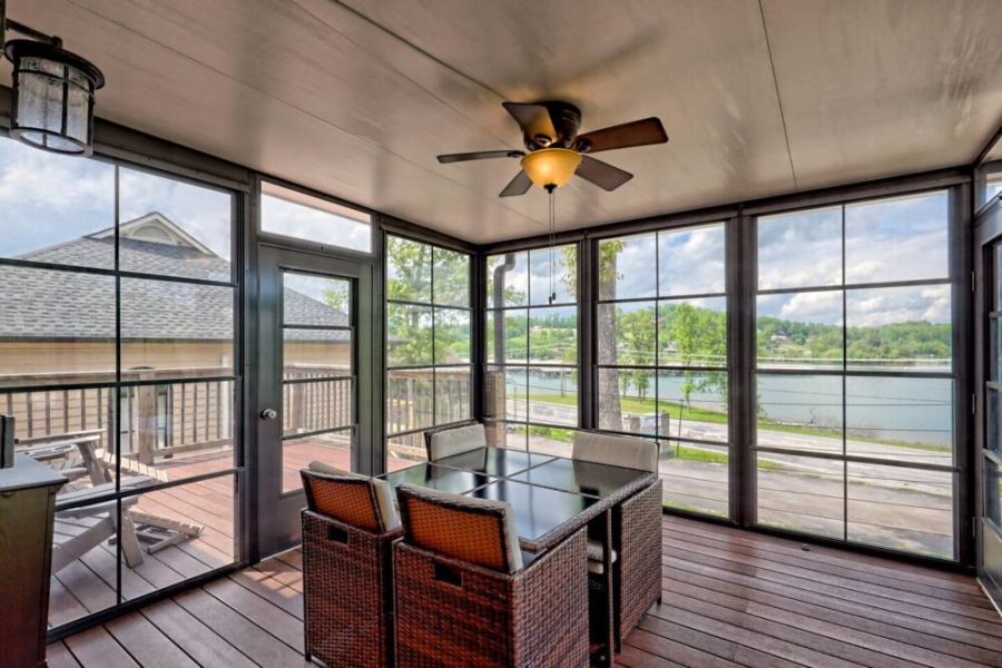 All weather sunroom with a nice view of the lake and seating for 4.