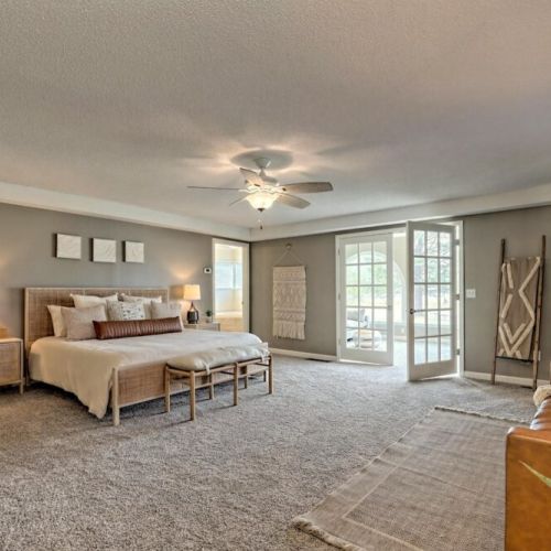 Look at this spacious bedroom, complete with a nice sofa and french doors to the deck.