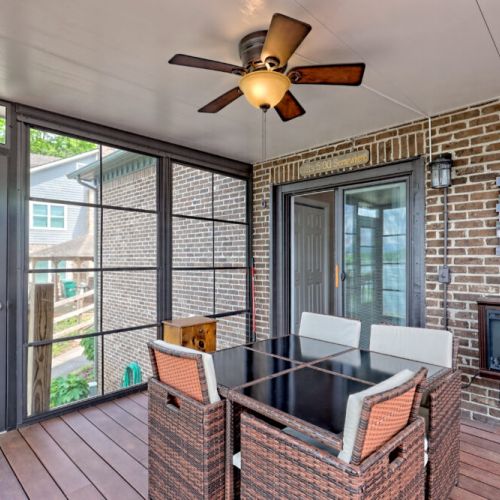 This sunroom includes a nice wall fireplace