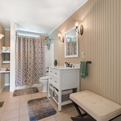 Shared main floor bathroom with shower & tub.