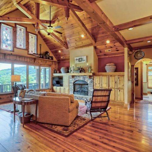What beautiful vaulted ceilings and views out the large floor to ceiling windows