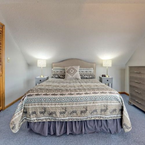 Loft Q bedroom with soft carpeting