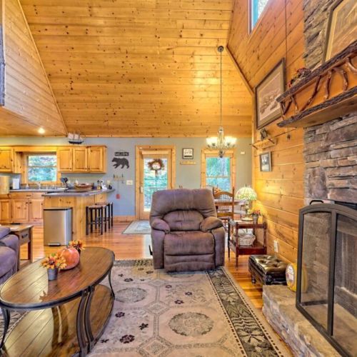 Living room next to the large stacked stone fireplace