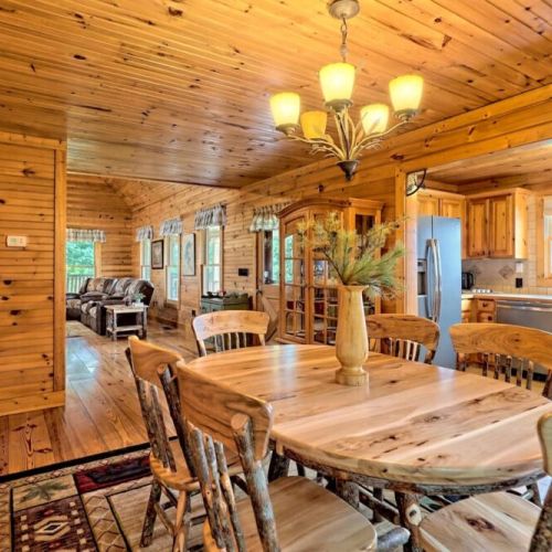 Dining area into kitchen with the living room just beyond