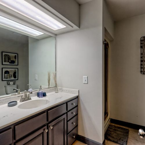 Bathroom with shower across from laundry room.