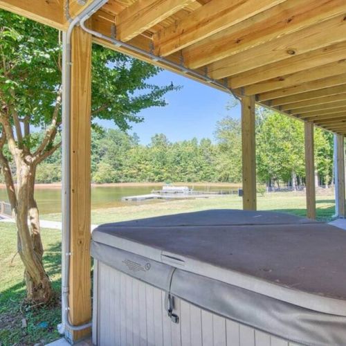 Lower deck complete with hot tub and more seating options to watch the water sports or just enjoy the weather.