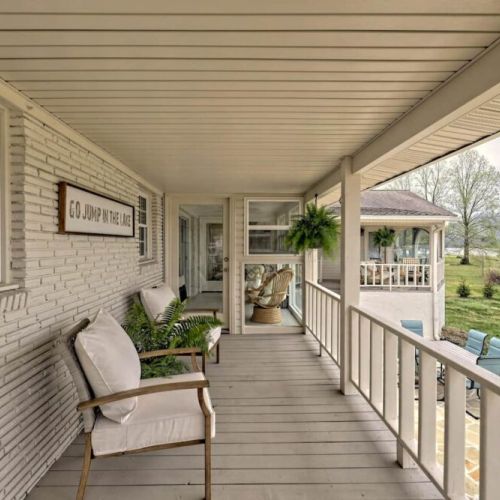 A wonderful back porch that overlooks the fire pit, lake and dock