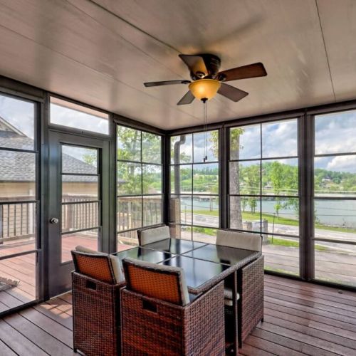 All weather sunroom with a nice view of the lake and seating for 4.
