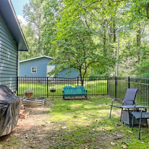 Outdoor dog run with a smoker.