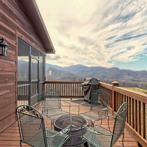 Outdoor grilling area with dining with firepit and just look at those mountain views!