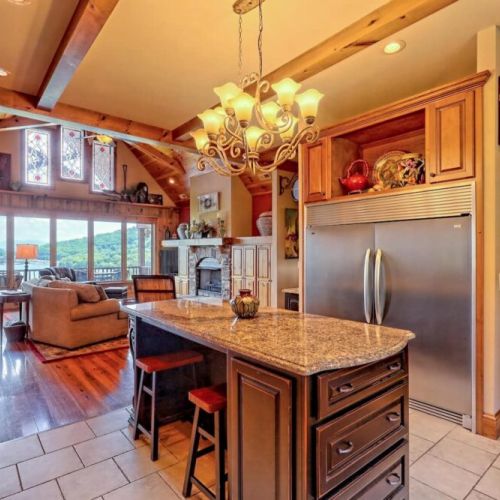 Large island with 2  long stools for that snack spot
