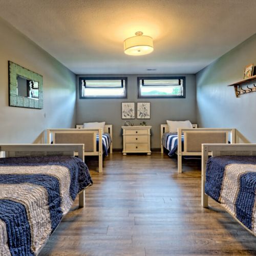 Upstairs bunk rooms with 4 single beds
