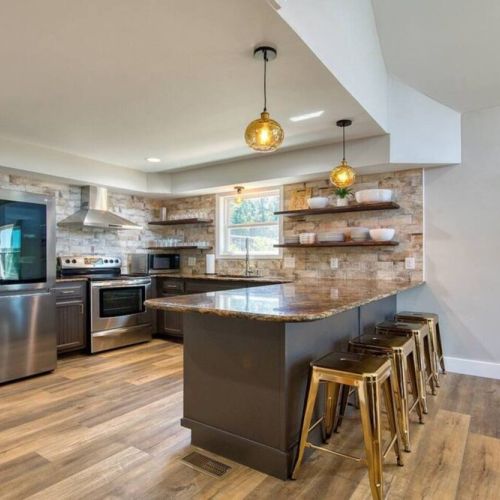 Lower level kitchen and breakfast bar with seating for 4.