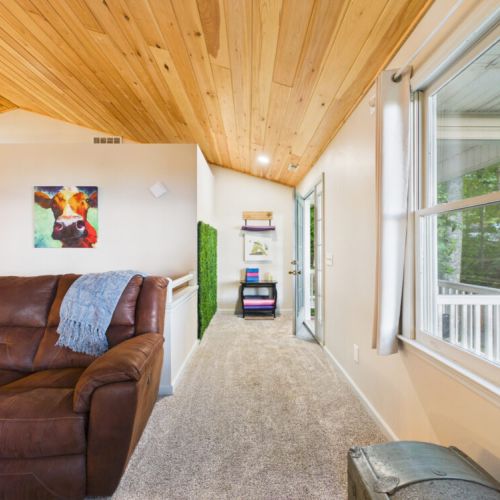 Upper level living room with yoga space