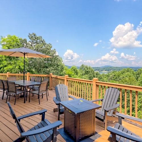 Main level patio with a firepit, out door seating and grill.