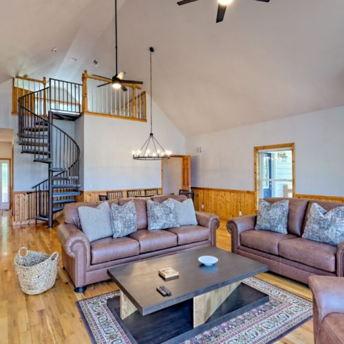 Living, dining and stairs to loft.