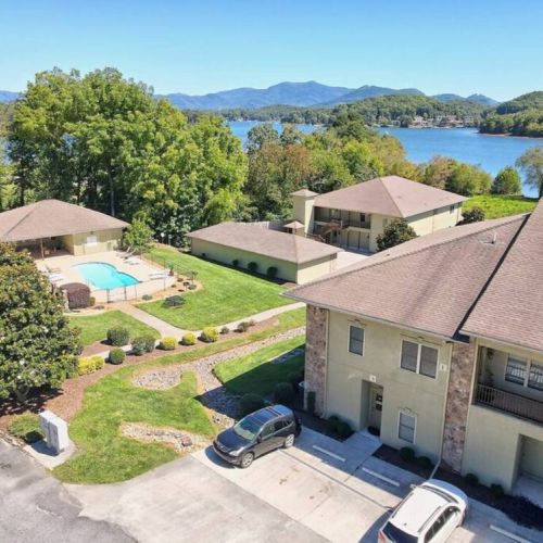 View of Condo and Pool area & Lake