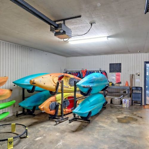 Garage with complimentary kayaks and paddleboards.