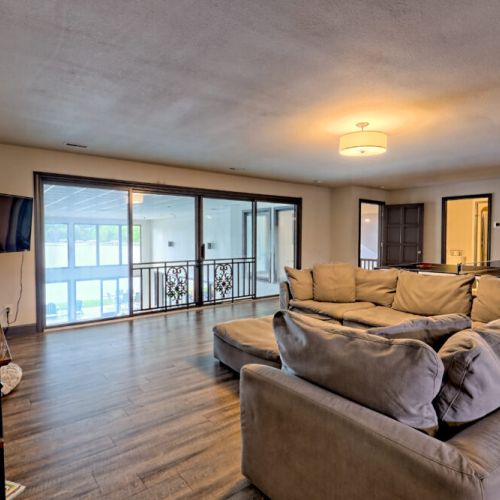 Upstairs lounging / game / TV area overlooking the pool and lake.